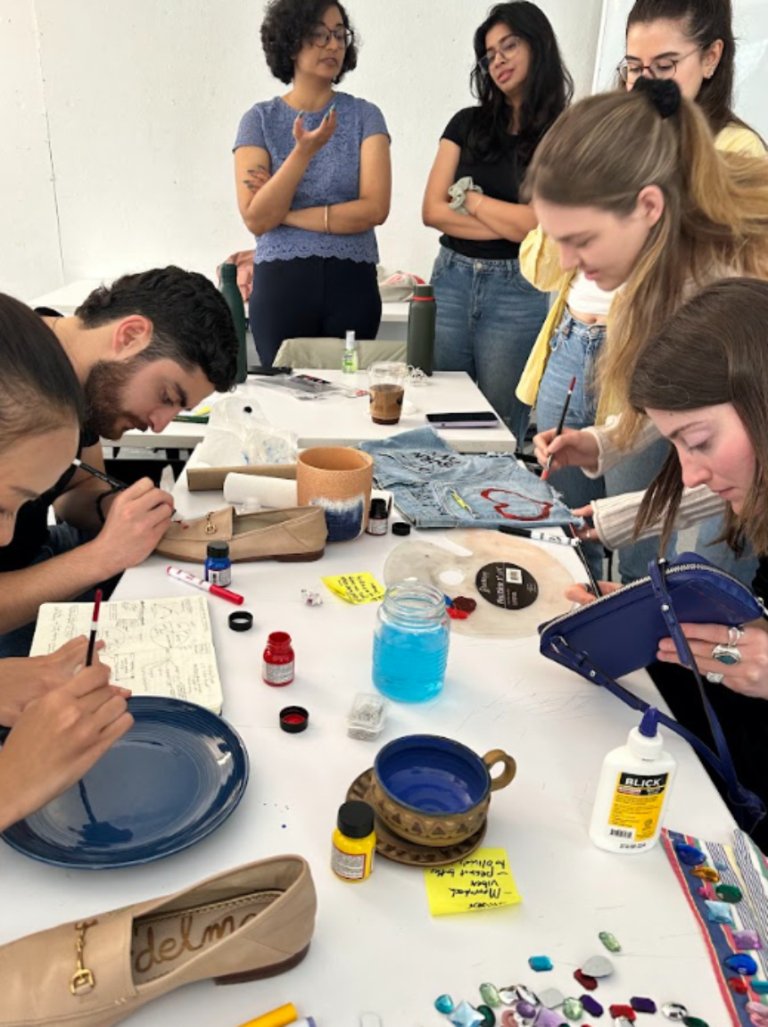 Test run: classmates customizing secondhand pieces with paint and embroidery